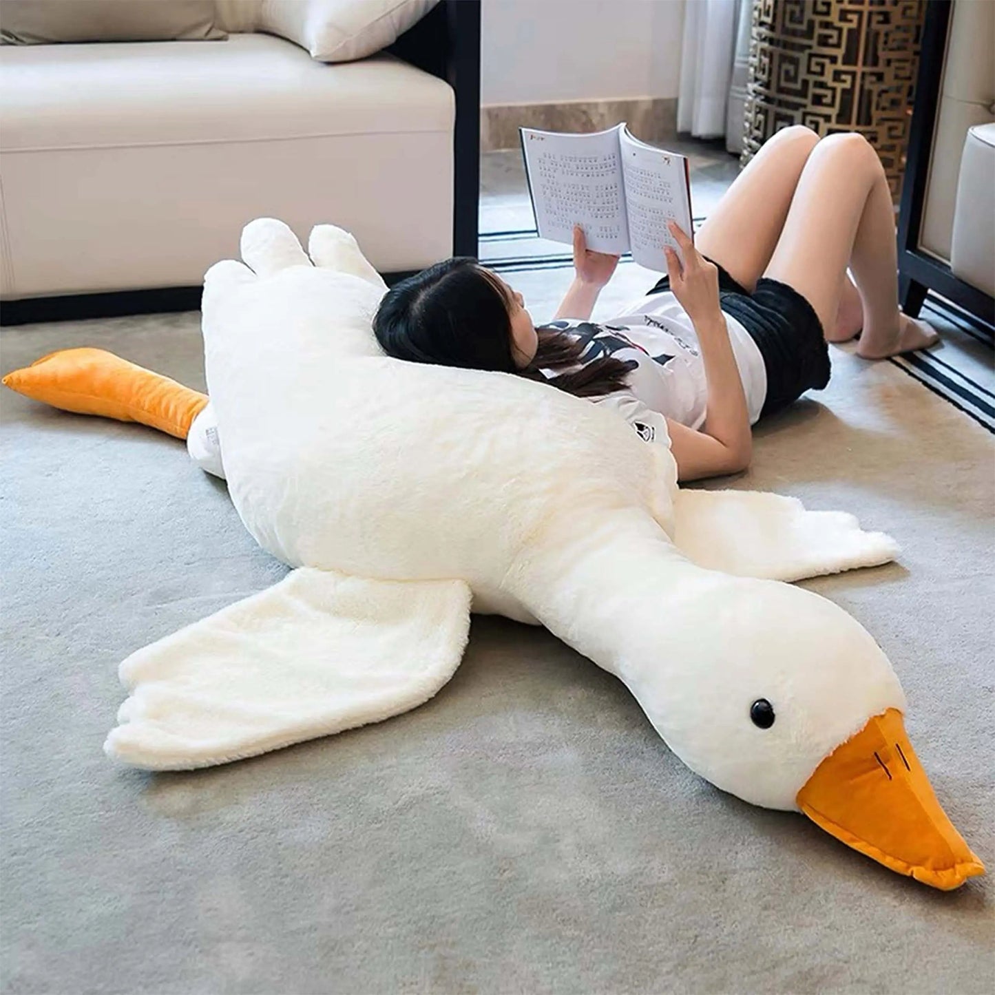 Treat yourself to a moment of softness with this giant goose-shaped cushion plush. 