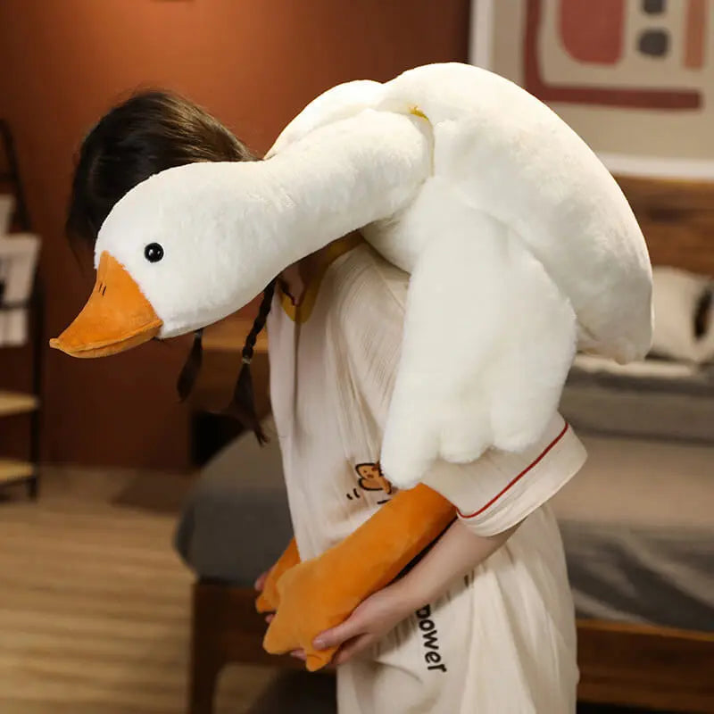 Treat yourself to a moment of softness with this giant goose-shaped cushion plush. 