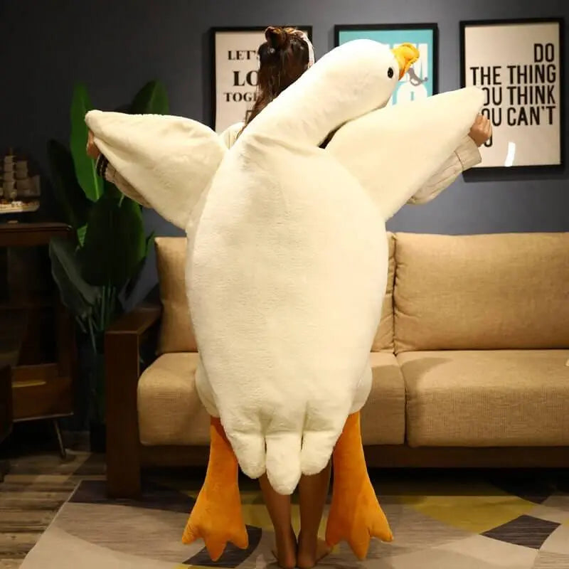 Treat yourself to a moment of softness with this giant goose-shaped cushion plush. 