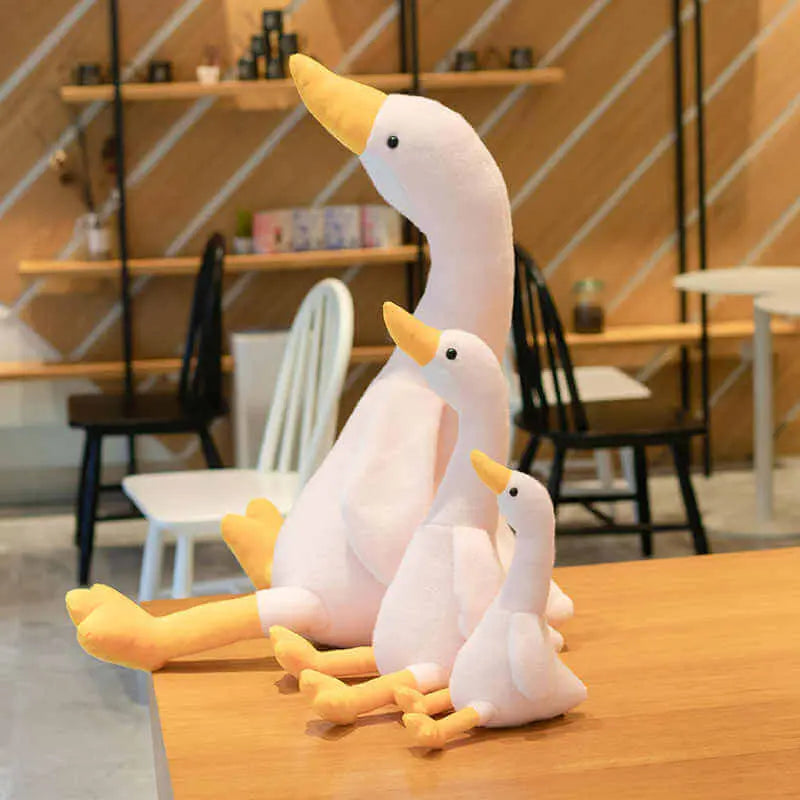 Treat yourself to a moment of softness with this giant goose-shaped cushion plush. 